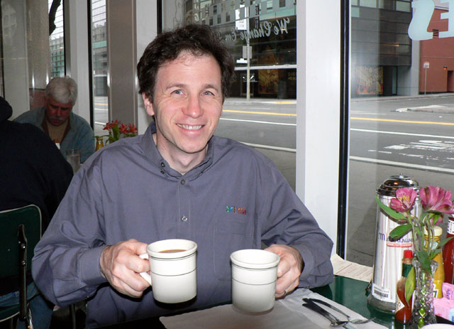 Bill Venners holding two cups of coffee
